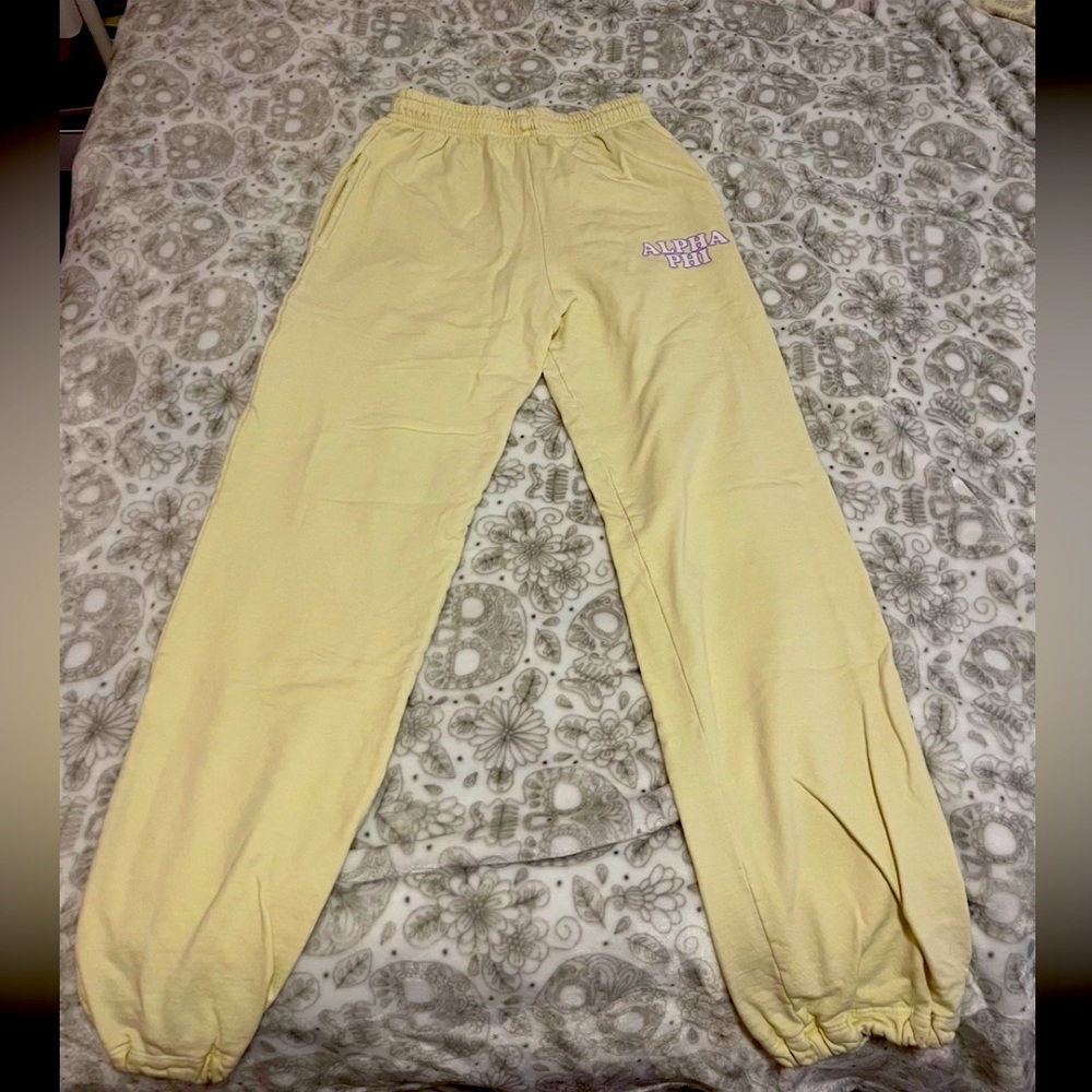 Light yellow Alpha Phi Madhappy copycat sweatpants w/ “ALPHA PHI” bubble letters